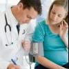 doctor-examines-pregnant-woman.jpg